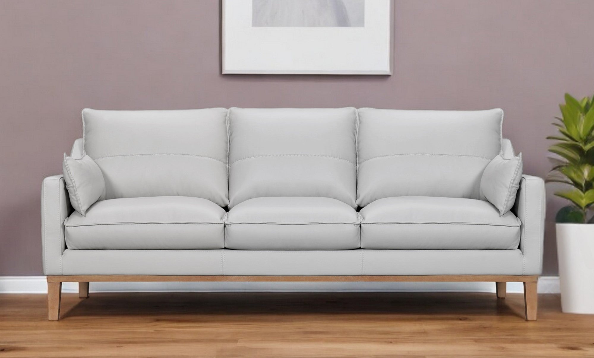 87" Gray Leather Sofa And Toss Pillows With Brown Legs-0