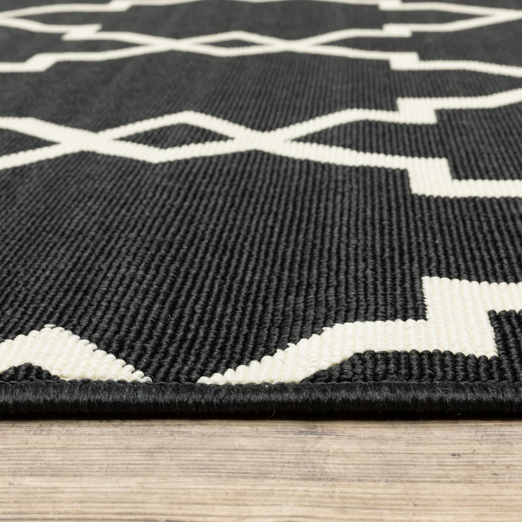 7' X 10' Black And Ivory Indoor Outdoor Area Rug-Outdoor Rugs-DECOROLALA