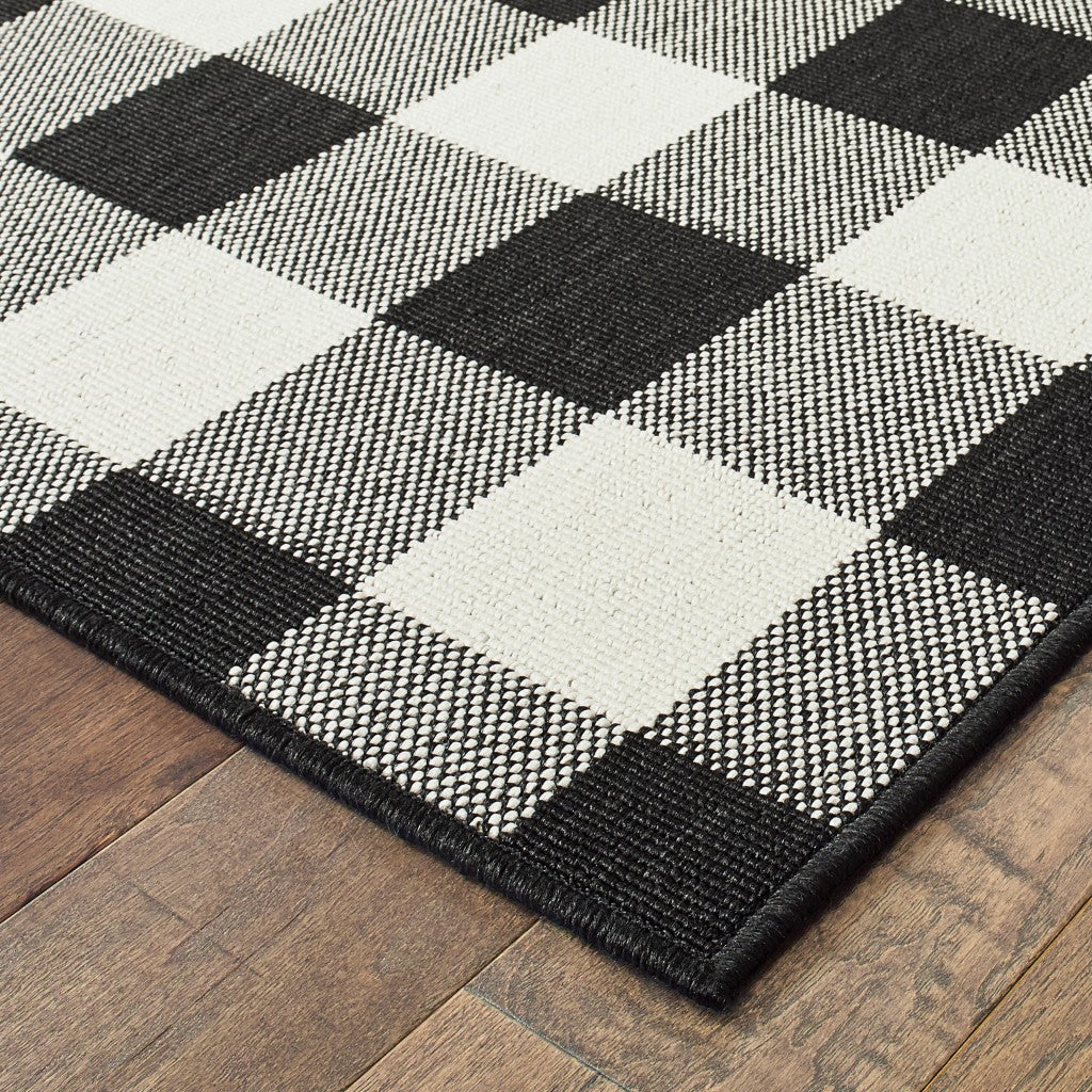 7' X 10' Black And Ivory Indoor Outdoor Area Rug-Outdoor Rugs-DECOROLALA