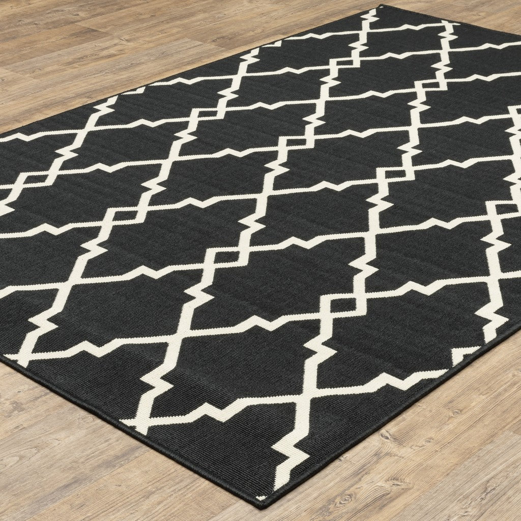 7' X 10' Black And Ivory Indoor Outdoor Area Rug-Outdoor Rugs-DECOROLALA