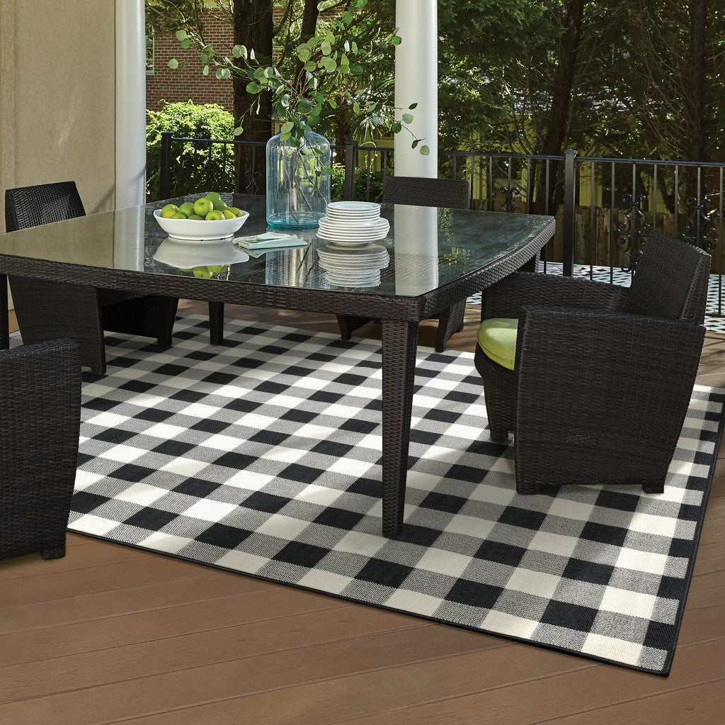 7' X 10' Black And Ivory Indoor Outdoor Area Rug-Outdoor Rugs-DECOROLALA