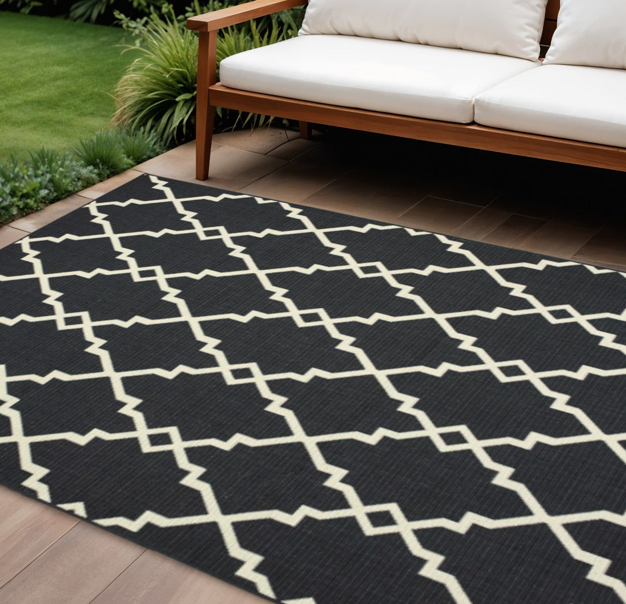 7' X 10' Black And Ivory Indoor Outdoor Area Rug-Outdoor Rugs-DECOROLALA