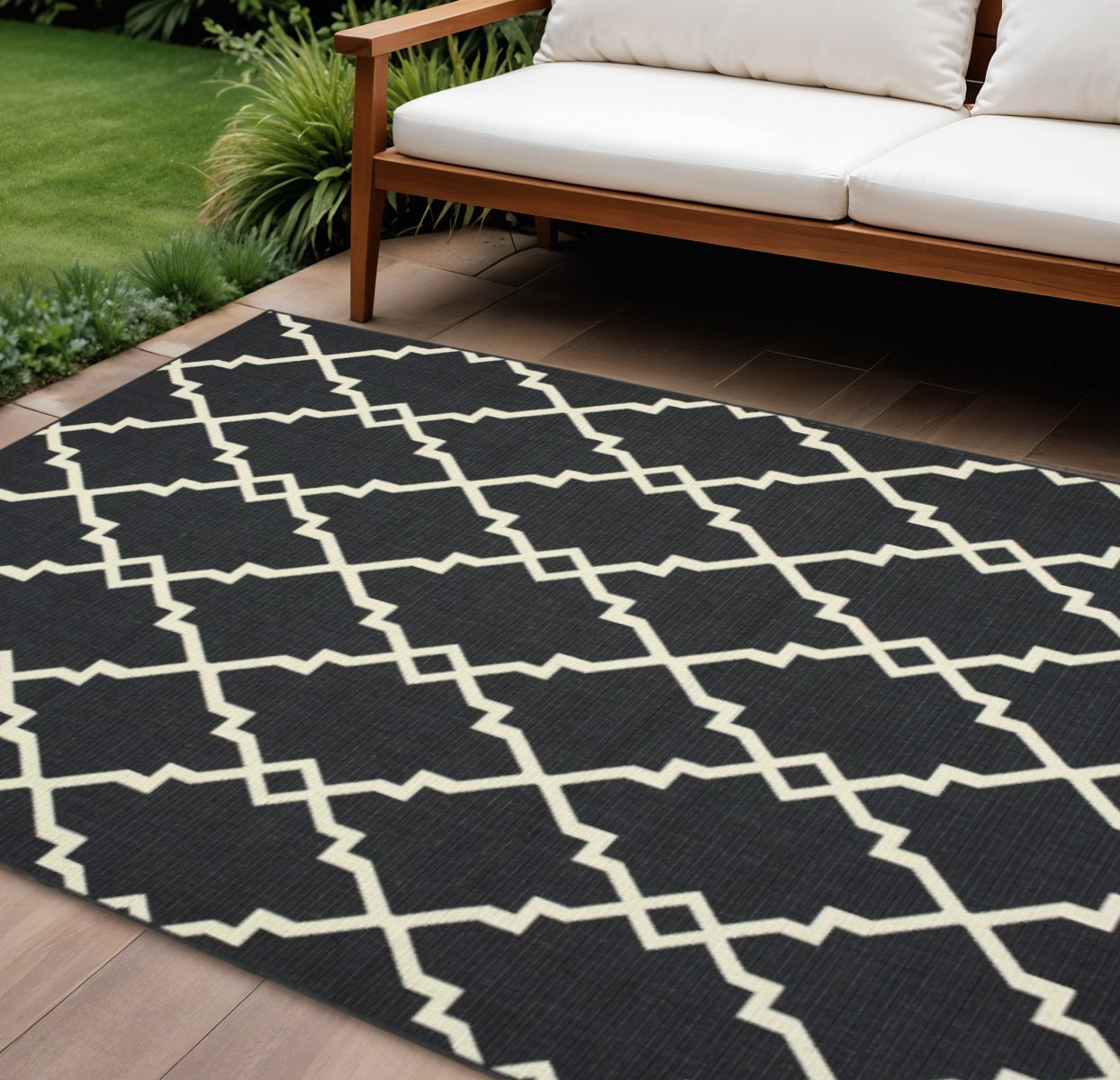 7' X 10' Black And Ivory Indoor Outdoor Area Rug-Outdoor Rugs-DECOROLALA