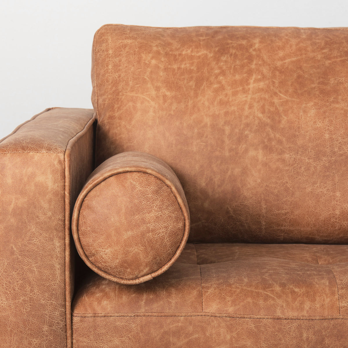 Loretta 88.0L x 36.2W x 33.9H Cognac Brown Faux Leather Three Seater Sofa with Two Bolster Cushions-Sofa & Sectionals-DECOROLALA
