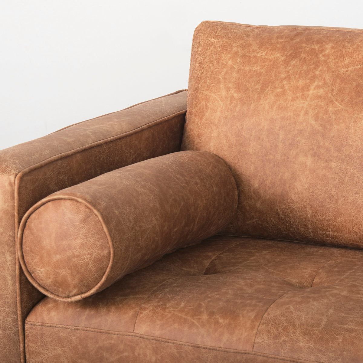 Loretta 88.0L x 36.2W x 33.9H Cognac Brown Faux Leather Three Seater Sofa with Two Bolster Cushions-Sofa & Sectionals-DECOROLALA