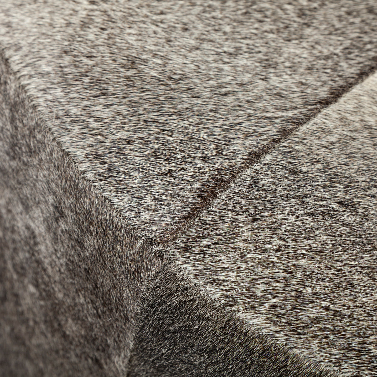 Zahavi I 23"H grey-toned hair-on-hide ottoman-Stools & Ottomans-DECOROLALA